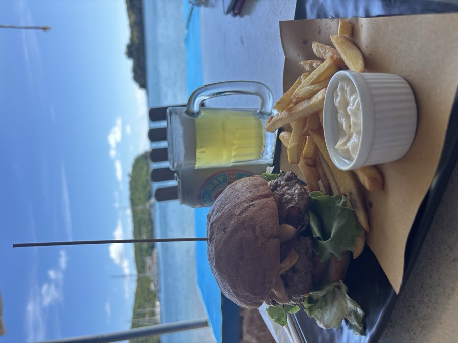 Burger, fries and a cold beer by the sea