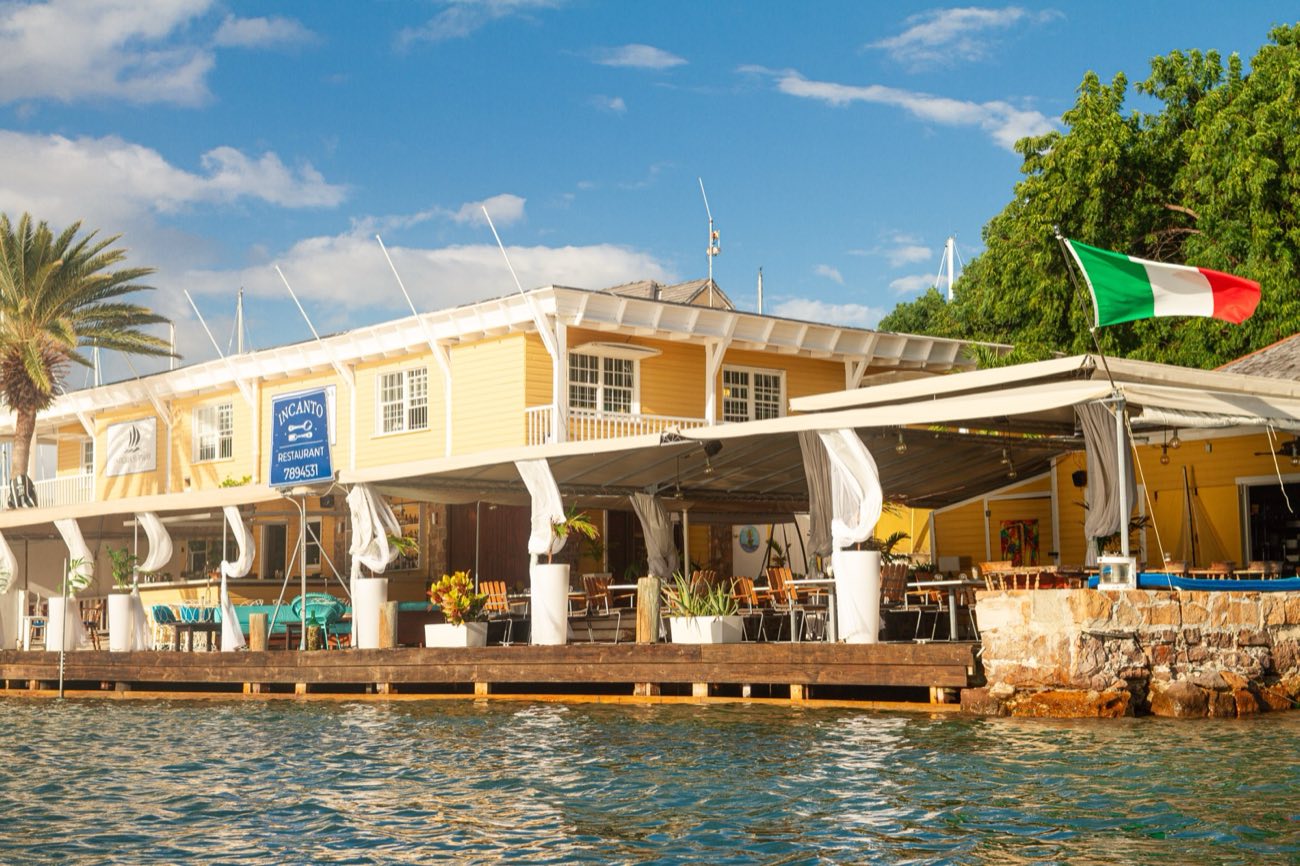 Incanto Italian restaurant at the end of the dock at Antigua Slipway, English Harbour, seen from the water