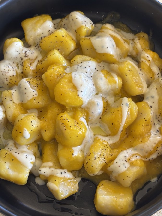 Homemade pumpkin gnocchi with blue cheese cream